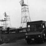 Stepvan leaving Main Transmitter area - troposcatter tower in foreground